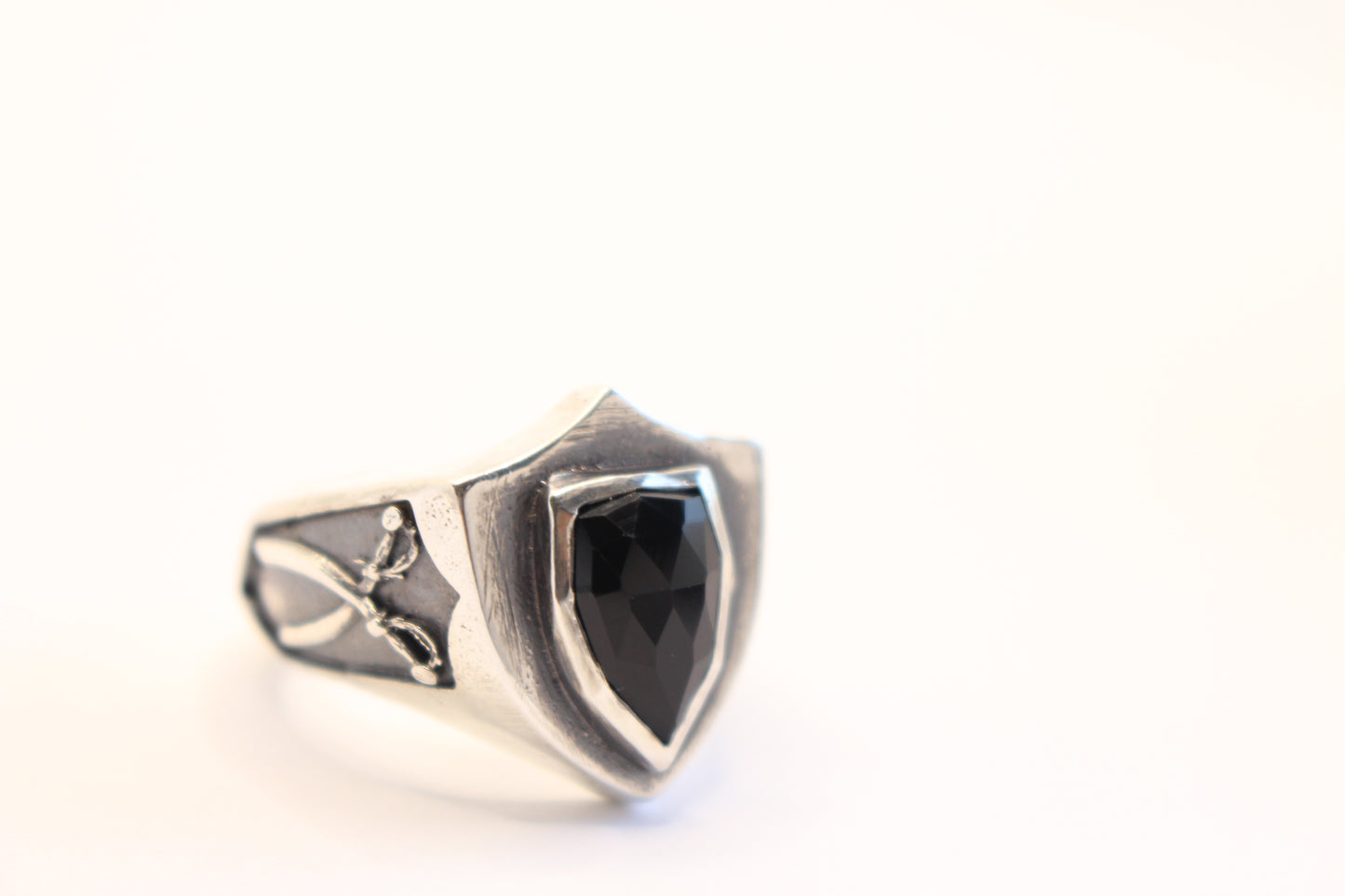 Sterling Silver and Onyx stone with crossed swords on the sides