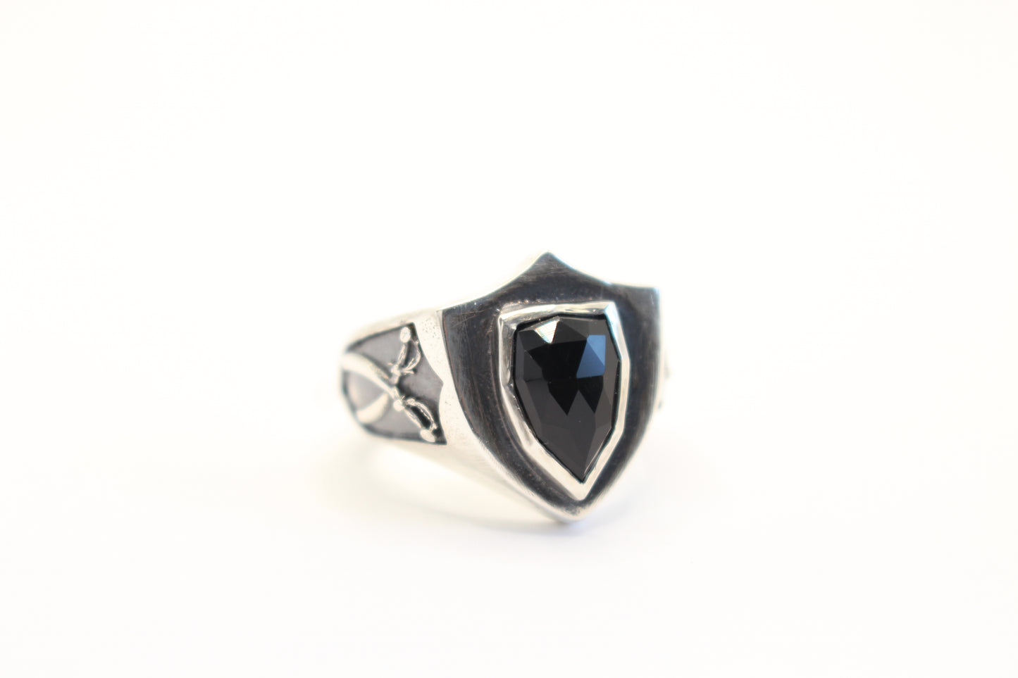 Sterling Silver and Onyx stone with crossed swords on the sides