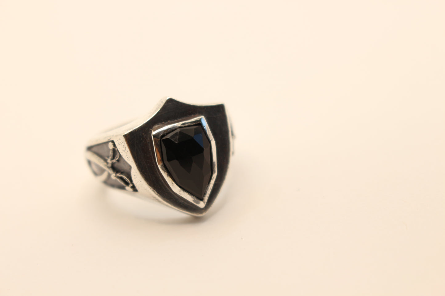 Sterling Silver and Onyx stone with crossed swords on the sides