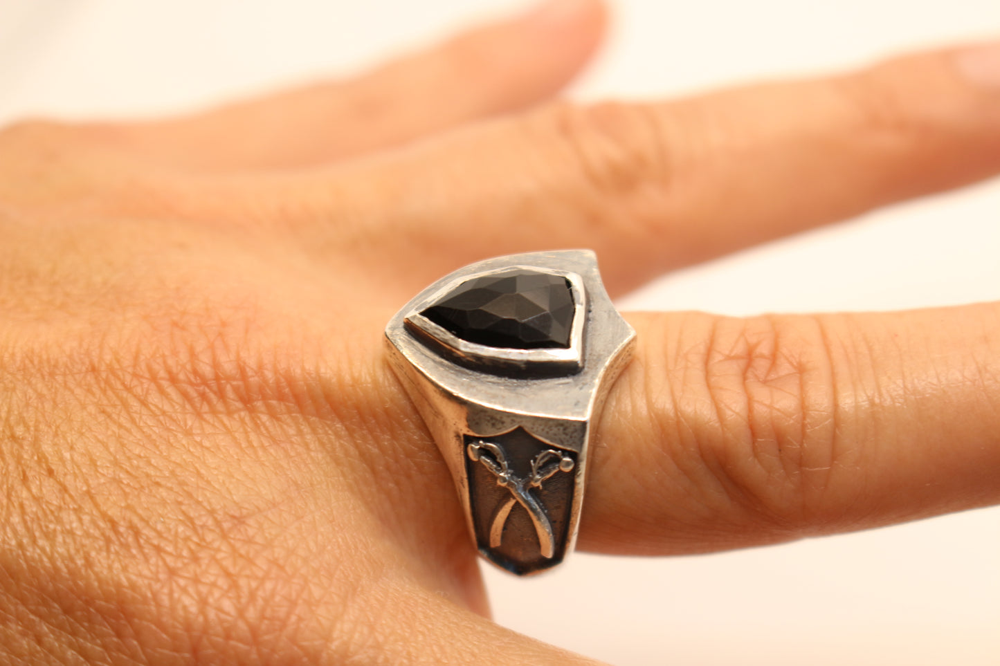 Sterling Silver and Onyx stone with crossed swords on the sides